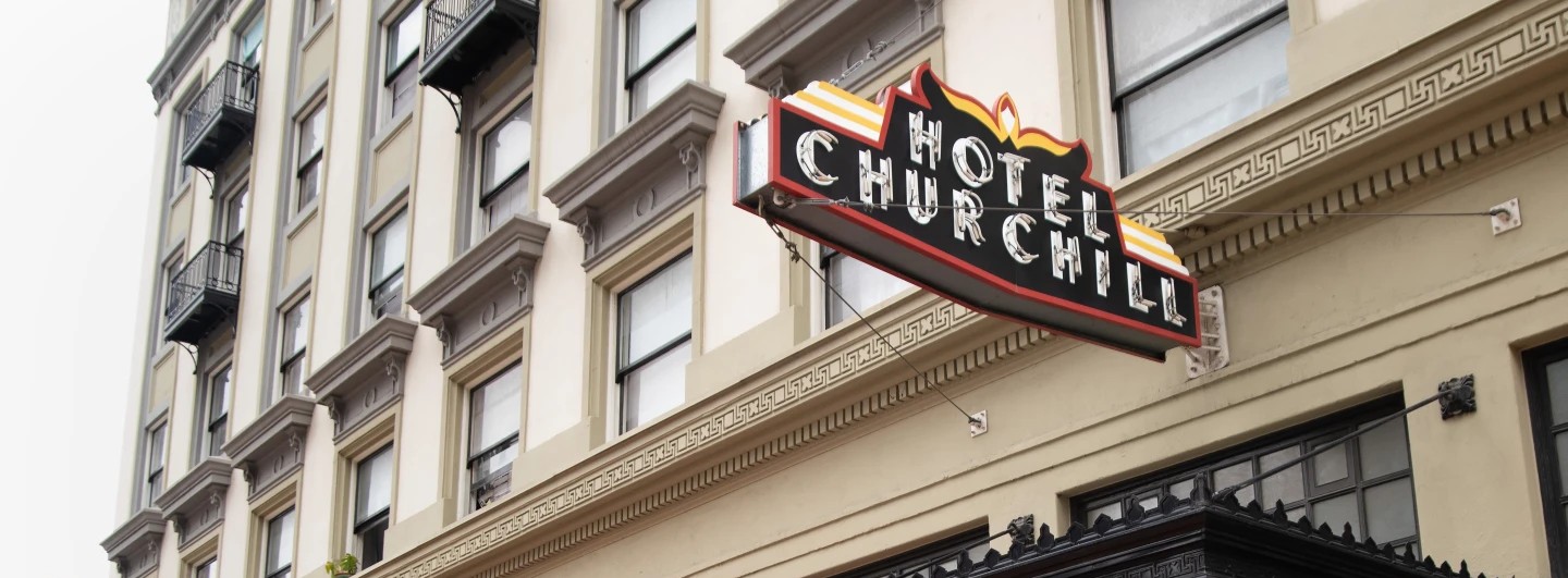 The exterior of the Hotel Churchill is shown